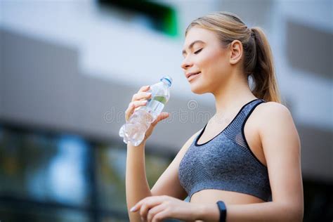 woman tests bottled water|women's health water reviews.